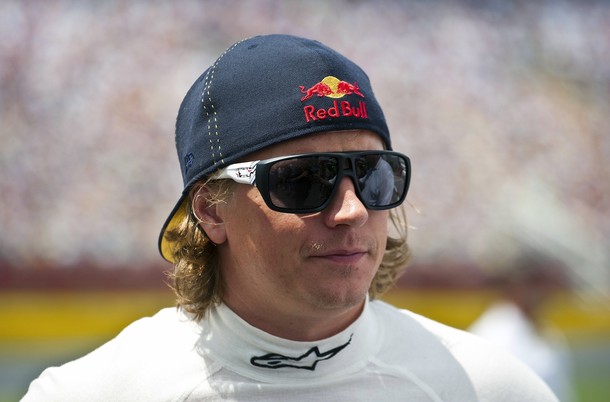 Kimi Raikkonen of Finland waits near his car before the NASCAR Nationwide Series Top Gear 300 in North Carolina