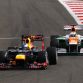 SAKHIR, BAHRAIN - APRIL 22:  Sebastian Vettel (L) of Germany and Red Bull Racing and Paul di Resta (R) of Great Britain and Force India drive side by side during the Bahrain Formula One Grand Prix at the Bahrain International Circuit on April 22, 2012 in Sakhir, Bahrain.  (Photo by Paul Gilham/Getty Images)