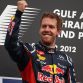 SAKHIR, BAHRAIN - APRIL 22:  Sebastian Vettel of Germany and Red Bull Racing celebrates on the podium after winning the Bahrain Formula One Grand Prix at the Bahrain International Circuit on April 22, 2012 in Sakhir, Bahrain.  (Photo by Clive Mason/Getty Images)