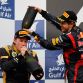 SAKHIR, BAHRAIN - APRIL 22:  Race winner Sebastian Vettel (R) of Germany and Red Bull Racing celebrates on the podium with second placed Kimi Raikkonen (L) of Finland and Lotus following the Bahrain Formula One Grand Prix at the Bahrain International Circuit on April 22, 2012 in Sakhir, Bahrain.  (Photo by Paul Gilham/Getty Images)