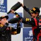 SAKHIR, BAHRAIN - APRIL 22:  Race winner Sebastian Vettel (R) of Germany and Red Bull Racing celebrates on the podium with second placed Kimi Raikkonen (L) of Finland and Lotus following the Bahrain Formula One Grand Prix at the Bahrain International Circuit on April 22, 2012 in Sakhir, Bahrain.  (Photo by Paul Gilham/Getty Images)