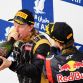 SAKHIR, BAHRAIN - APRIL 22:  Race winner Sebastian Vettel (R) of Germany and Red Bull Racing celebrates on the podium with second placed Kimi Raikkonen (L) of Finland and Lotus following the Bahrain Formula One Grand Prix at the Bahrain International Circuit on April 22, 2012 in Sakhir, Bahrain.  (Photo by Mark Thompson/Getty Images)