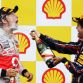 SPA FRANCORCHAMPS, BELGIUM - AUGUST 28:  Race winner Sebastian Vettel (R) of Germany and Red Bull Racing celebrates with third placed Jenson Button (L) of Great Britain and McLaren on the podium after the Belgian Formula One Grand Prix at the Circuit of Spa Francorchamps on August 28, 2011 in Spa Francorchamps, Belgium.  (Photo by Vladimir Rys/Getty Images)