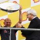 SPA FRANCORCHAMPS, BELGIUM - AUGUST 28:  Red Bull Racing Chief Technical Officer Adrian Newey (L) is presented with the Constructors Trophy by Shell CEO Peter Voser (R) on the podium after the Belgian Formula One Grand Prix at the Circuit of Spa Francorchamps on August 28, 2011 in Spa Francorchamps, Belgium.  (Photo by Mark Thompson/Getty Images)
