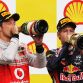 SPA FRANCORCHAMPS, BELGIUM - AUGUST 28:  Race winner Sebastian Vettel (R) of Germany and Red Bull Racing celebrates with third placed Jenson Button (L) of Great Britain and McLaren on the podium after the Belgian Formula One Grand Prix at the Circuit of Spa Francorchamps on August 28, 2011 in Spa Francorchamps, Belgium.  (Photo by Vladimir Rys/Getty Images)