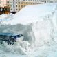 Cars buried in snow
