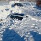 Cars buried in snow