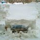 Cars buried in snow