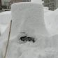 Cars buried in snow