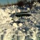 Cars buried in snow