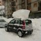 Cars buried in snow