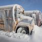 Cars buried in snow