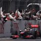 Team members congratulate McLaren Formula One driver Lewis Hamilton of Britain after winning the Chinese F1 Grand Prix at Shanghai International circuit April 17, 2011.    REUTERS/David Gray (CHINA - Tags: SPORT MOTOR RACING)