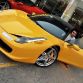 dhiaa-al-essa-with-his-ferrari-458-italia-before-it-was-destroyed-in-a-fire