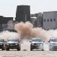 Four Volkswagens Amarok pull down a giant chimney
