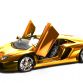 Gold Lamborghini Aventador Miniature by Robert Guelpen
