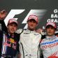 Brawn GP's British driver Jenson Button (C), Red Bull's German driver Sebastian Vettel (L) and Toyota's Italian driver Jarno Trulli celebrate on the podium of the Sakhir racetrack after the Bahrain Formula One Grand Prix, on April 26, 2009 in Manama.Brawn GP's British driver Jenson Button won the race ahead of Red Bull's German driver Sebastian Vettel and Toyota's Italian driver Jarno Trulli.           AFP PHOTO / FRED DUFOUR (Photo credit should read FRED DUFOUR/AFP/Getty Images)
