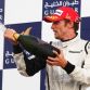SAKHIR, BAHRAIN - APRIL 26:  Jenson Button of Great Britain and Brawn GP celebrates on the podium after winning the Bahrain Formula One Grand Prix at the Bahrain International Circuit on April 26, 2009 in Sakhir, Bahrain.  (Photo by Clive Mason/Getty Images) *** Local Caption *** Jenson Button