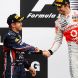 MONTREAL, CANADA - JUNE 12:  Race winner Jenson Button (R) of Great Britain and McLaren is congratulated by second placed Sebastian Vettel (L) of Germany and Red Bull Racing on the podium following the Canadian Formula One Grand Prix at the Circuit Gilles Villeneuve on June 12, 2011 in Montreal, Canada.  (Photo by Mark Thompson/Getty Images)