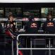 MONTREAL, CANADA - JUNE 12:  Sebastian Vettel (2nd left) of Germany and Red Bull Racing sits in his team pitwall area during the rain delay in the Canadian Formula One Grand Prix at the Circuit Gilles Villeneuve on June 12, 2011 in Montreal, Canada.  (Photo by Paul Gilham/Getty Images)