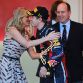 MONTE CARLO, MONACO - MAY 29:  Sebastian Vettel of Germany and Red Bull Racing receives the winners trophy from Prince Albert II of Monaco and his girlfriend Charlene Wittsock after the Monaco Formula One Grand Prix at the Monte Carlo Circuit on May 29, 2011 in Monte Carlo, Monaco.  (Photo by Paul Gilham/Getty Images)