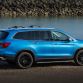 2016 Honda Pilot with accessories installed, including: 20-inch black wheels; chrome door mirror cover; chrome tailgate trim; running boards with lights; roof rails with crossbars; illuminated door sill trim; and chrome front bumper trim.