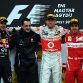 BUDAPEST, HUNGARY - JULY 31:  Race winner Jenson Button of Great Britain and McLaren celebrates on the podium with second placed Sebastian Vettel of Germany and Red Bull Racing and third placed Fernando Alonso of Spain and Ferrari following the Hungarian Formula One Grand Prix at the Hungaroring on July 31, 2011 in Budapest, Hungary.  (Photo by Lars Baron/Getty Images)