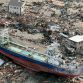 A vessel sits after it was washed away by tsunami into urban area in Kesennuma, Miyagi, northern Japan March 12. Photo Credit: Kyodo News/Associated Press