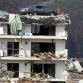 A vehicle sits on a three-story building at Minamisanriku town in Miyagi prefecture Sunday after tsunami damaged the area.  Photo Credit: Jiji Press / AFP - Getty Images