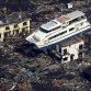 A pleasure boat sitting on top of a building amid a sea of debris in Otsuchi town in Iwate prefecture on March 14.  Photo Credit: Yomiuri Shimbun via AFP - Getty Images