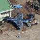 A Japanese Air Self Defence Force plane pushed into a hangar by the tsunami at a base in Higashimatsushima in Miyagi prefecture on March 14.  Photo Credit: Noboru Hashimoto / AFP - Getty Images