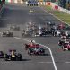 SUZUKA, JAPAN - OCTOBER 09:  Sebastian Vettel (2nd left) of Germany and Red Bull Racing leads from Jenson Button (left) of Great Britain and McLaren towards the first corner at the start of the Japanese Formula One Grand Prix at Suzuka Circuit on October 9, 2011 in Suzuka, Japan.  (Photo by Mark Thompson/Getty Images)