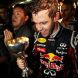 SUZUKA, JAPAN - OCTOBER 09:  Sebastian Vettel of Germany and Red Bull Racing celebrates with team mates in the pitlane after finishing third to secure his second F1 World Drivers Championship during the Japanese Formula One Grand Prix at Suzuka Circuit on October 9, 2011 in Suzuka, Japan.  (Photo by Clive Rose/Getty Images)