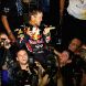 SUZUKA, JAPAN - OCTOBER 09:  Sebastian Vettel of Germany and Red Bull Racing celebrates with team mates in the pitlane after finishing third to secure his second F1 World Drivers Championship during the Japanese Formula One Grand Prix at Suzuka Circuit on October 9, 2011 in Suzuka, Japan.  (Photo by Clive Mason/Getty Images)
