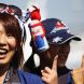 SUZUKA, JAPAN - OCTOBER 09:  Sebastian Vettel fans give his famous one fingered salute while attending the Japanese Formula One Grand Prix at Suzuka Circuit on October 9, 2011 in Suzuka, Japan.  (Photo by Clive Rose/Getty Images)