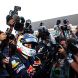 SUZUKA, JAPAN - OCTOBER 09:  Sebastian Vettel of Germany and Red Bull Racing celebrates with team mates after finishing third to secure his second F1 World Drivers Championship during the Japanese Formula One Grand Prix at Suzuka Circuit on October 9, 2011 in Suzuka, Japan.  (Photo by Clive Rose/Getty Images)