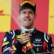 SUZUKA, JAPAN - OCTOBER 09:  Sebastian Vettel of Germany and Red Bull Racing celebrates on the podium after finishing third to secure his second F1 World Drivers Championship during the Japanese Formula One Grand Prix at Suzuka Circuit on October 9, 2011 in Suzuka, Japan.  (Photo by Clive Rose/Getty Images)