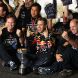 SUZUKA, JAPAN - OCTOBER 09:  Sebastian Vettel (C) of Germany and Red Bull Racing celebrates in the pitlane with Red Bull Racing Team Principal Christian Horner (L), Red Bull Racing Chief Technical Officer Adrian Newey (R) and the rest of his team mates after finishing third to secure his second F1 World Drivers Championship during the Japanese Formula One Grand Prix at Suzuka Circuit on October 9, 2011 in Suzuka, Japan.  (Photo by Clive Rose/Getty Images)