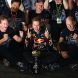 SUZUKA, JAPAN - OCTOBER 09:  Sebastian Vettel (C) of Germany and Red Bull Racing celebrates in the pitlane with Red Bull Racing Team Principal Christian Horner (L), Red Bull Racing Chief Technical Officer Adrian Newey (R) and the rest of his team mates after finishing third to secure his second F1 World Drivers Championship during the Japanese Formula One Grand Prix at Suzuka Circuit on October 9, 2011 in Suzuka, Japan.  (Photo by Clive Mason/Getty Images)