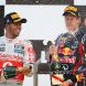 YEONGAM-GUN, SOUTH KOREA - OCTOBER 16:  Race winner Sebastian Vettel (R) of Germany and Red Bull Racing celebrates on the podium with second placed Lewis Hamilton (L) of Great Britain and McLaren following the Korean Formula One Grand Prix at the Korea International Circuit on October 16, 2011 in Yeongam-gun, South Korea.  (Photo by Clive Mason/Getty Images)