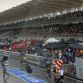 Formula one drivers wait for rain to stop during Formula One\'s Malaysian Grand Prix at the Sepang International Circuit in Sepang on March 25, 2012. AFP PHOTO/ Prakash SINGH (Photo credit should read PRAKASH SINGH/AFP/Getty Images)
