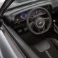 The interior of the Dodge Shakedown Challenger is further transformed with modern modifications including a black leather shift boot capped by an SRT Hellcat gearshift knob and black Mopar instrument panel gauges contrasted with gloss carbon fiber instrument panel cluster trim.