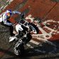 MILTON KEYNES, ENGLAND - DECEMBER 10:  Stunt motorcycle expert Chris Pfeiffer performs for the crowd while attending the Red Bull Racing Home Run event on December 10, 2011 in Milton Keynes, England.  (Photo by Andrew Hone/Getty Images for Red Bull)