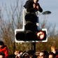 MILTON KEYNES, ENGLAND - DECEMBER 10: Fans try unusual vantage points while attending the Red Bull Racing Home Run event on December 10, 2011 in Milton Keynes, England.  (Photo by Richard Heathcote/Getty Images for Red Bull)