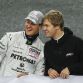 Formula One pilot Sebastian Vettel and Michael Schumacher (L) of Germany talk together before the Race of Champions (ROC) at the \'Esprit-Arena\'  in Duesseldorf, November 28, 2010.  REUTERS/Ina Fassbender (GERMANY - Tags: SPORT MOTOR RACING)