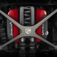 Performance cross-car x-brace. With a single-piece carbon fiber construction, this handmade brace has more than 30 layers of carbon fiber optimally aligned to manage driving loads. The brace features topology optimized structurally efficient design, aerospace-grade stainless steel attachment bushings, and significant weight savings over production aluminum engine brace. Polished, exposed carbon fiber weave complements hood inner finish. Front, carbon-fiber cross-car brace. Manufacturer’s Suggested Retail Price (MSRP): $3,175, part number 82213416