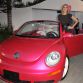 (insert star name) riding in the Volkswagen customized pink New Beetle convertible at Barbie's Dream House 50th Birthday Party