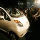 India media persons film the giant Tata group's "Nano" car at the launch in New Delhi, 10 January 2008. India's giant Tata Group unveiled a 2,500 USD car it bills as the world's cheapest amid predictions the compact, no-frills vehicle could revolutionise how the nation of 1.1 billion people travels.  AFP PHOTO/ MANAN VATSYAYANA (Photo credit should read RAVEENDRAN/AFP/Getty Images)